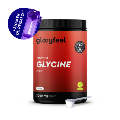 Se muestra un envase de 1000 g de L-Glicina en Polvo de gloryfeel GmbH España con un cacito blanco y un agitador morado con la etiqueta "Shaker de regalo." El producto es vegano.