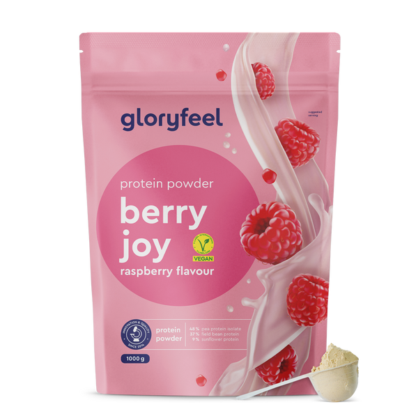 Bolsa rosa con Proteina Berry Joy - Sabor a frambuesa de gloryfeel GmbH España. La etiqueta muestra &quot;berry joy&quot; y &quot;vegano&quot;, con una cucharada de polvo en primer plano.