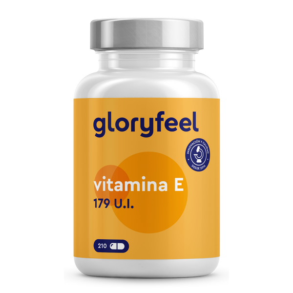 Un frasco de Vitamina E 179 UI de GloryFeel GmbH España contiene 210 cápsulas. El diseño naranja y blanco resalta sus propiedades antioxidantes, mientras que un sello azul indica los estándares de producción.