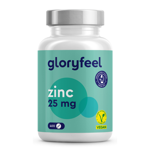 Un frasco de Zinc 25 mg en tabletas de GloryFeel GmbH España contiene 400 comprimidos para apoyar el metabolismo de las proteínas, con símbolos veganos y de garantía de calidad sobre un fondo verde azulado.