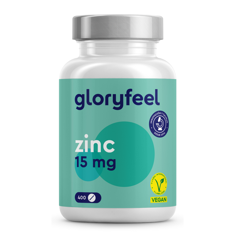 Una botella de Gloryfeel GmbH Zinc 15 mg - 400 tabletas, enriquecida con gluconato de zinc, presenta una etiqueta verde azulado con un diseño circular y el logotipo de "5 años", ideal para apoyar su sistema inmunológico.